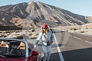 Carefree woman traveling by car