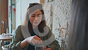 Carefree women communicating lunch break in cafe closeup. Stylish girl talking