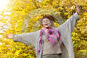Carefree young african american woman with arms outstretched photo