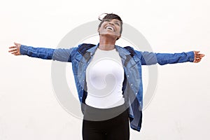Carefree young woman with arms outstretched photo