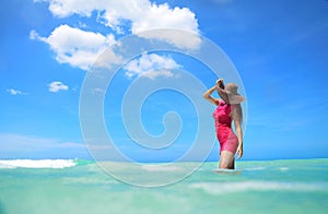 Carefree young woman enjoying clear water of the carribean sea