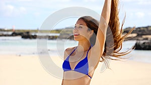 Carefree young woman have fun on white sand beach. Happy cheerful slim girl weight loss concept