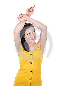 Carefree young woman with raised arms up, isolated on white background. Careless female person