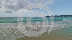 Carefree young woman relaxing on exotic beach. Caribbean tropical vacation