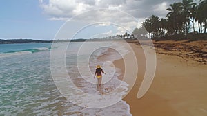 Carefree young woman relaxing on exotic beach. Caribbean tropical vacation