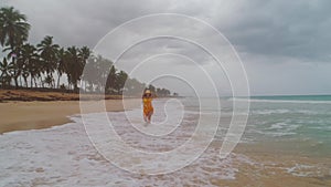 Carefree young woman relaxing on exotic beach. Caribbean tropical vacation