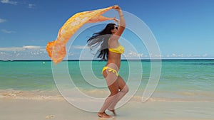 Carefree young woman relaxing on exotic beach. Caribbean tropical vacation. Dominican Republic.