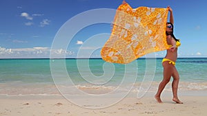 Carefree young woman relaxing on Punta Cana beach. Caribbean vacation. Dominican Republic