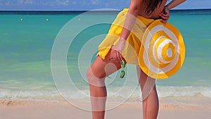 Carefree young woman relaxing on Punta Cana beach. Caribbean vacation. Dominican Republic