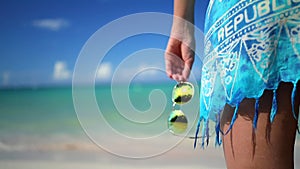 Carefree young woman relaxing on Punta Cana beach. Caribbean vacation. Dominican Republic