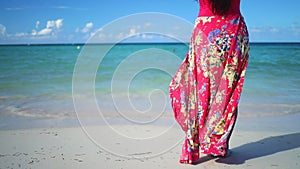 Carefree young woman relaxing on Punta Cana beach. Caribbean vacation. Dominican Republic