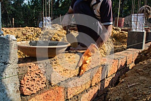 Careful Brick Placement During Wall Construction