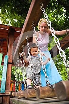 Careful mother helping son