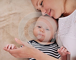 Careful mother with her newborn son