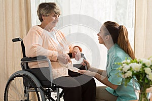 Caregiver helping old female