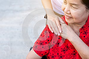 Caregiver holding hands to elderly Asian woman with Alzheimer disease,Positive thinking,Happy and smiling,Adult social care concep
