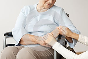 Caregiver supporting disabled pensioner