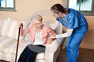 A caregiver will change your life for the better. a caregiver assisting her senior patient at home.