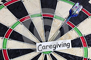 Caregiving senior caregiver help elderly health elder care support dartboard game