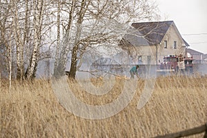 Careless handling of fire leads to forest fires. dry grass, branches and trees burn. Azov German national district of Omsk region