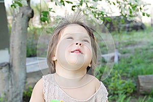 Careless happy smiling little girl portrait in summer 4 years old, smiling child