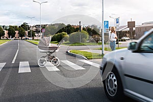 Careless mother speaking by phone while her baby pram rolled out on the road