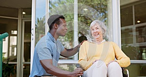 Carer man, senior woman and wheelchair with smile, conversation and outdoor for recovery on patio. Medic, doctor and