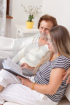 Carer spending time with an elderly woman