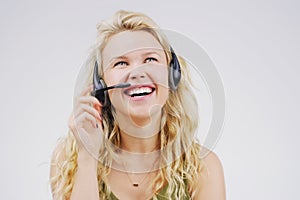 She cares about every customer. Studio shot of an attractive young female customer service representative wearing a