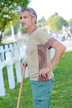 caretaker looking out over army cemetery