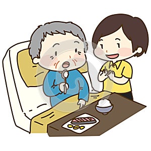 Caretaker supporting old man with eating photo