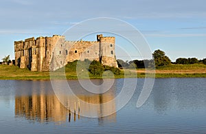 Carew castle in Pembrokeshire on a summer evening.