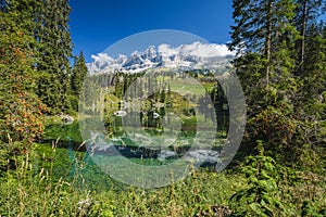 Carezza lake - Lago di Carezza, Karersee with Mount Latemar, Bolzano province, South tyrol, Italy. Landscape of Lake