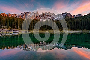 Carezza lake Lago di Carezza, Karersee with Mount Latemar, Bolzano province, South tyrol, Italy. Landscape of Lake Carezza or photo