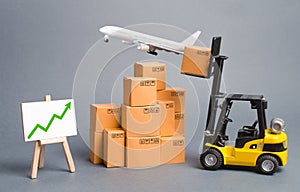 Cargo airplane, forklift truck with cardboard boxes and green arrow up. Increase freight transportation and delivery volumes photo