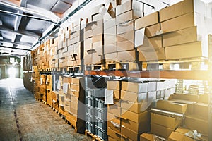 Cargo cardboard boxes for shipping and delivery in logistic storage warehouse hangar, interior of storehouse inside