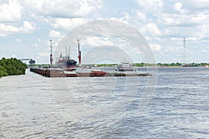 Cargo Carrier and Barges at New Orleans Terminal