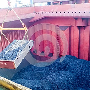 The cargo compartment of the ship, filled with coal. Loading of