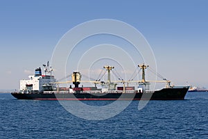 Cargo container freighter ship sailing photo