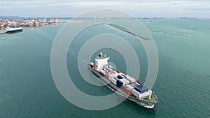 cargo container ship sailing full speed in sea to import export goods and distributing products to dealer and consumers across