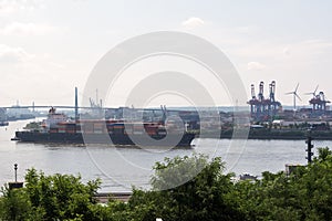 Cargo container ship sailing on the river