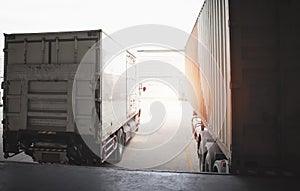 Cargo Container Trucks Parked Loading Dock at Distribution Warehouse. Shipping Trucks. Lorry. Freight Trucks Transport Logistics