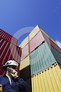 Cargo containers and dock worker photo