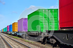 Cargo Containers Transportation On Freight Train By Railway. Intermodal Container On Train Car. Rail Freight Shipping Logistics