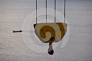 Cargo crane hook on the container ship