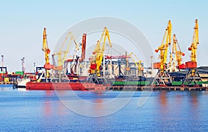 Cargo crane, ship and grain dryer in port
