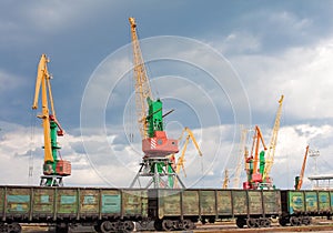 Cargo cranes and wagons in port