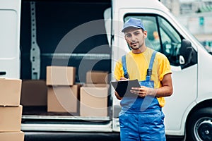 Cargo delivery service, male courier unload truck