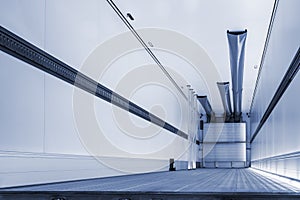 cargo empty semi-trailer with a clean floor, close-up view from behind