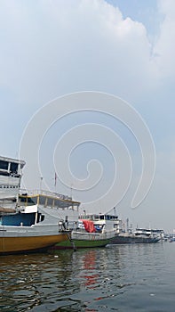 Cargo ferry boats ships lined up at port harbor in Jakarta